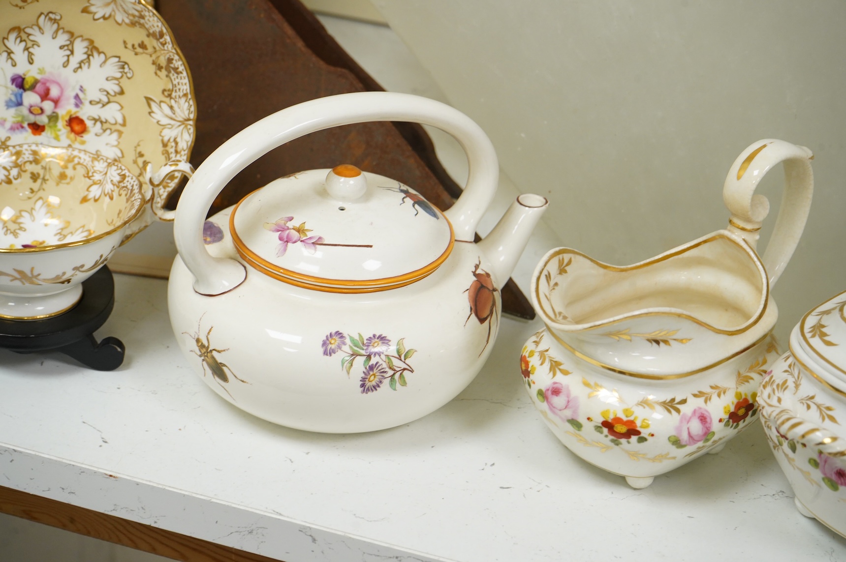 An early 19th century Derby three piece tea service, A pair of Staffordshire cow groups, Wedgwood etc